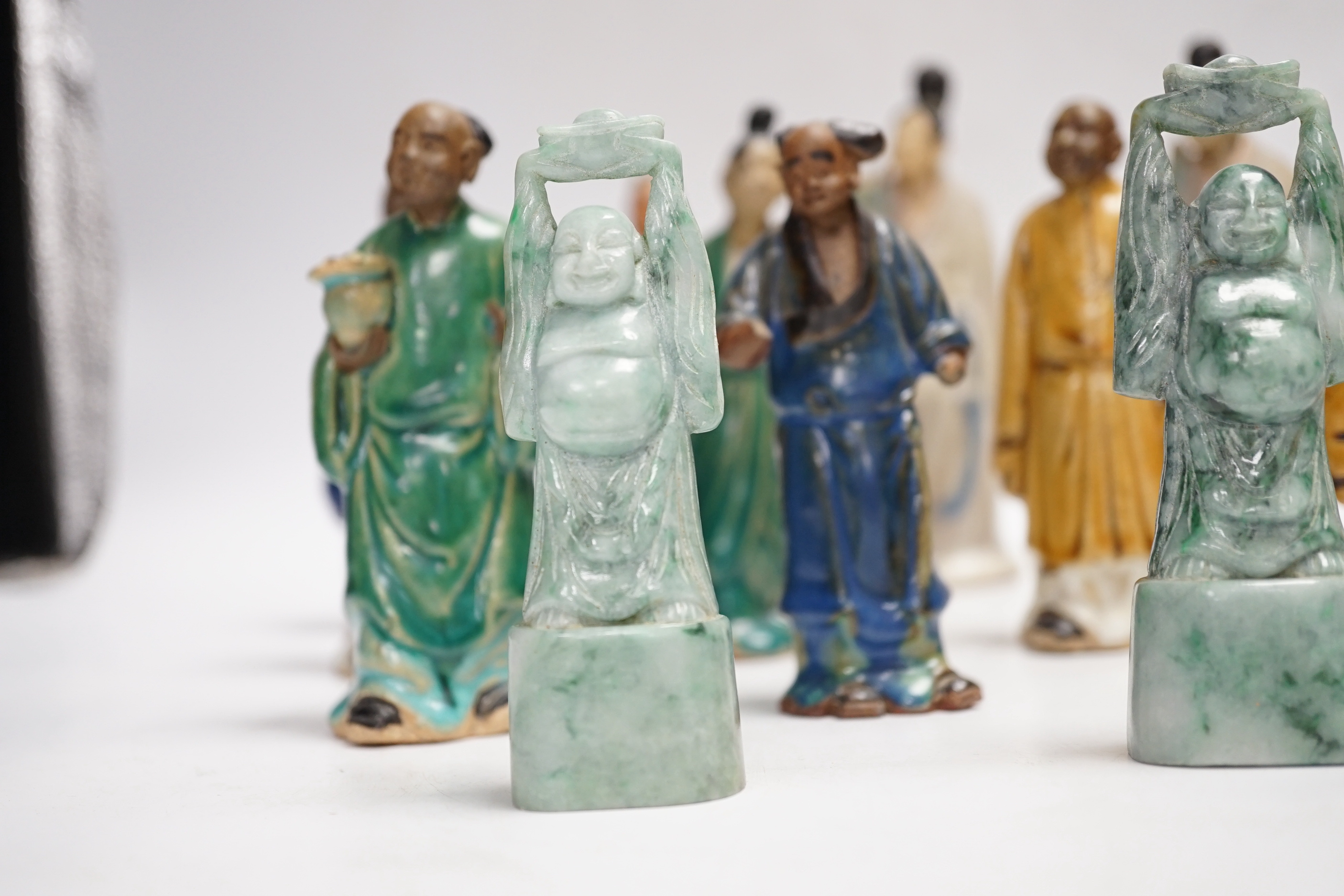 Fifteen Chinese Shiwan-type glazed pottery figures and carved stone figures, early 20th century, tallest 15cm